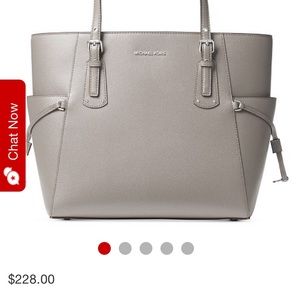 Michael Kors Voyager with silver pocket details